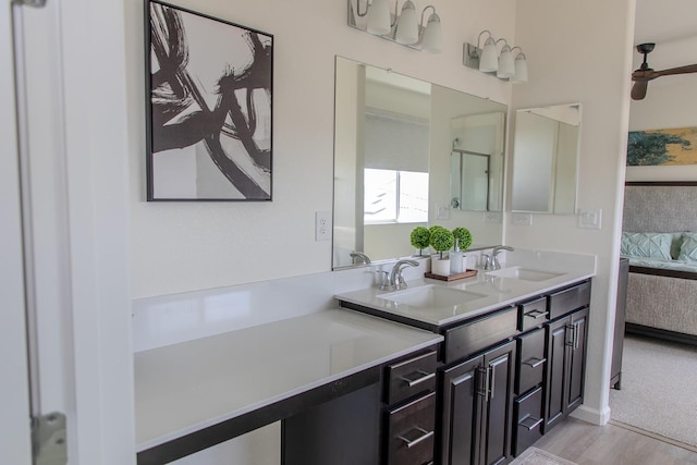 508 Laurel Crest Ave, Madera, CA 93636 - bathroom featuring ensuite bath, double vanity, and wood finished floors