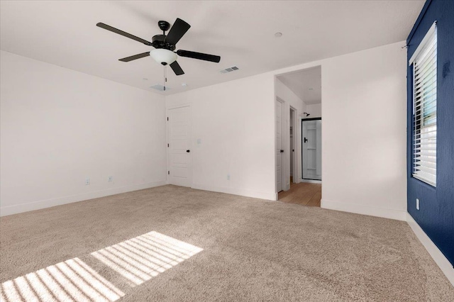 2520 S Spruce St, Visalia, CA 93292 - unfurnished room featuring light carpet, a ceiling fan, and baseboards