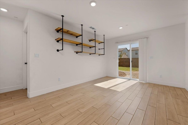 2520 S Spruce St, Visalia, CA 93292 - spare room featuring light wood-style floors, baseboards, and recessed lighting