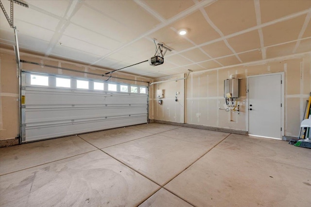 2520 S Spruce St, Visalia, CA 93292 - garage with a garage door opener and water heater