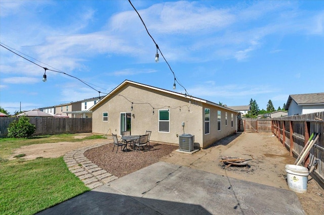 2520 S Spruce St, Visalia, CA 93292 - rear view of property featuring stucco siding, a fenced backyard, and a patio