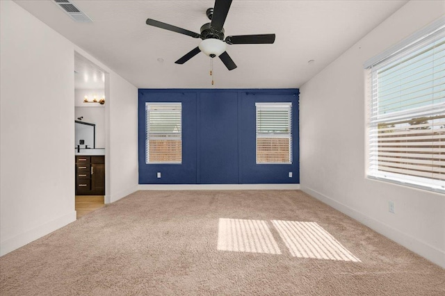 2520 S Spruce St, Visalia, CA 93292 - empty room with carpet floors, healthy amount of natural light, ceiling fan, and baseboards