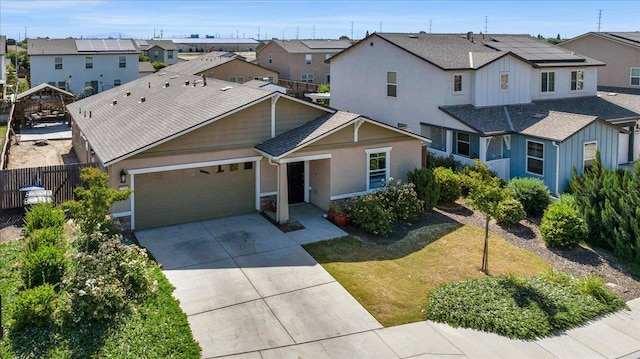2520 S Spruce St, Visalia, CA 93292 - view of front of property featuring a residential view, an attached garage, driveway, and stucco siding