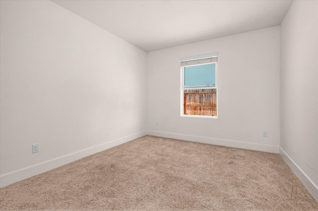 2520 S Spruce St, Visalia, CA 93292 - spare room featuring light carpet and baseboards