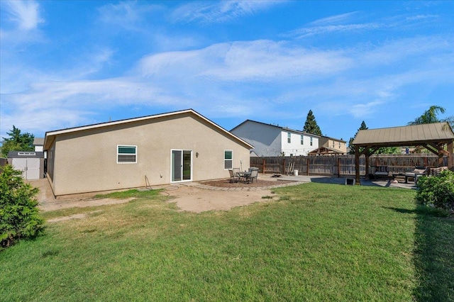 2520 S Spruce St, Visalia, CA 93292 - back of property featuring a gazebo, stucco siding, and a patio area