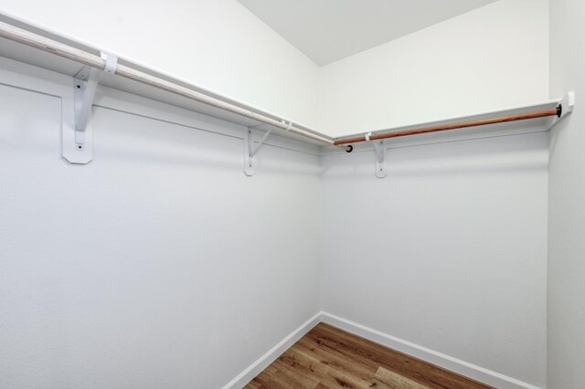 1892 E Goshen Ave, Fresno, CA 93720 - walk in closet with wood finished floors