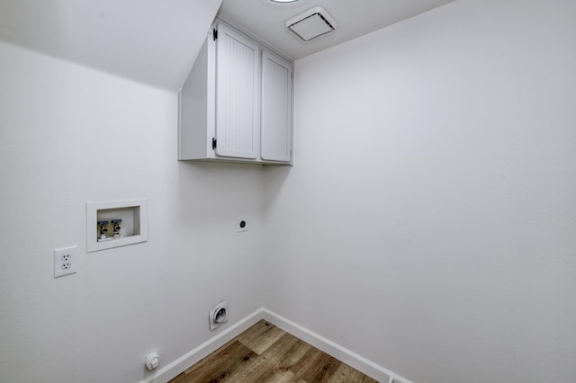 1892 E Goshen Ave, Fresno, CA 93720 - washroom with cabinet space, washer hookup, hookup for an electric dryer, light wood-style flooring, and baseboards