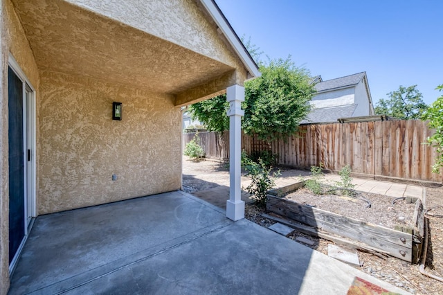 1892 E Goshen Ave, Fresno, CA 93720 - fenced backyard featuring a patio