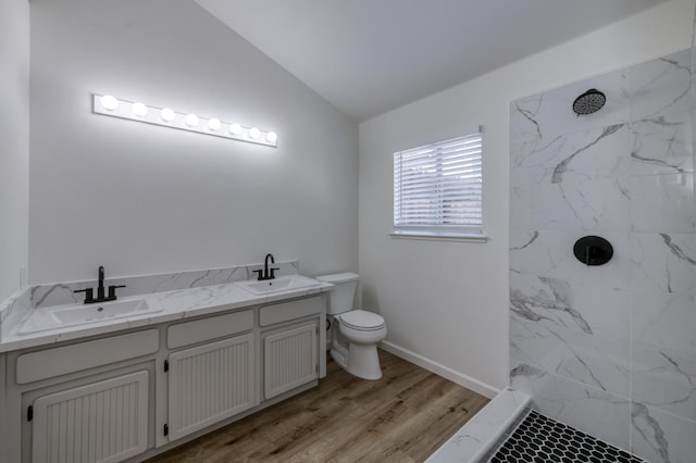 1892 E Goshen Ave, Fresno, CA 93720 - full bathroom with a marble finish shower, lofted ceiling, toilet, wood finished floors, and double vanity