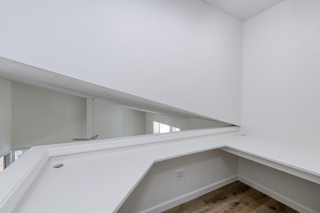 1892 E Goshen Ave, Fresno, CA 93720 - detailed view of wood finished floors, baseboards, and a textured ceiling