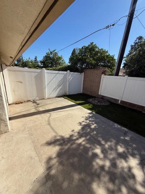 5749 N Monte Ave Unit 2, Fresno, CA 93711 - fenced backyard featuring a patio area