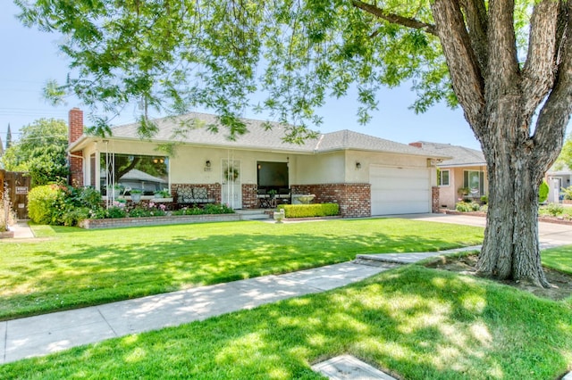 2934 N 8th St, Fresno, CA 93703 - ranch-style house featuring brick siding, an attached garage, driveway, a chimney, and a front yard