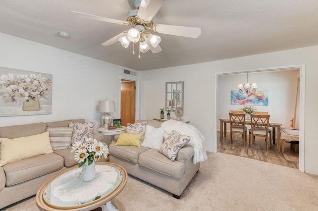 2934 N 8th St, Fresno, CA 93703 - carpeted living room featuring a chandelier and ceiling fan