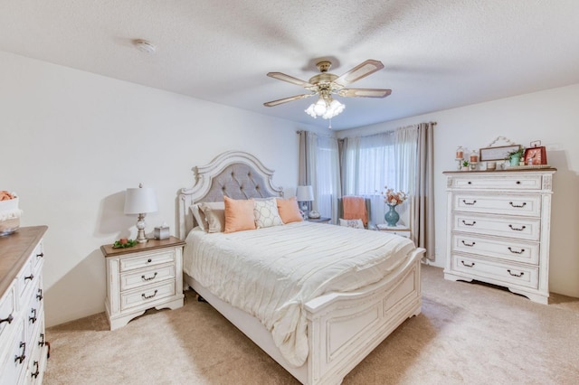 2934 N 8th St, Fresno, CA 93703 - bedroom featuring light colored carpet, a textured ceiling, and ceiling fan