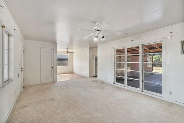 2626 E Princeton Ave, Fresno, CA 93703 - unfurnished living room with carpet, ceiling fan, and baseboards