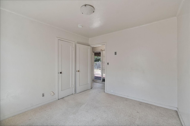2626 E Princeton Ave, Fresno, CA 93703 - unfurnished bedroom with carpet flooring, baseboards, and ornamental molding