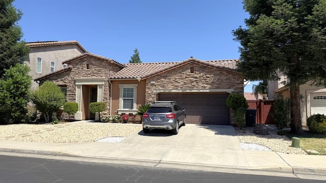 3257 Twain Ave, Clovis, CA 93619 - view of front of property with stone siding, an attached garage, stucco siding, a tiled roof, and driveway