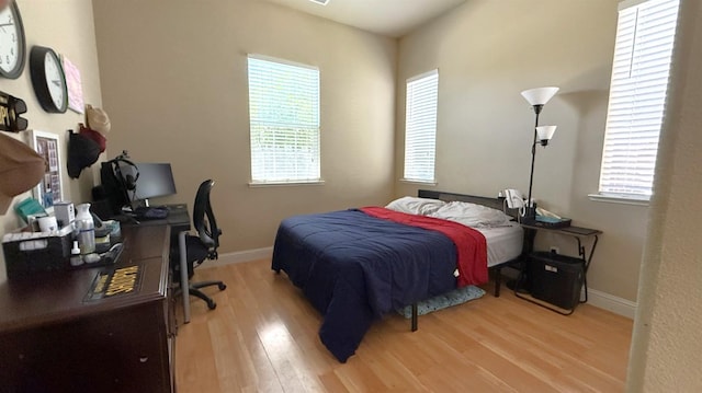 3257 Twain Ave, Clovis, CA 93619 - bedroom featuring wood finished floors, an office area, and baseboards