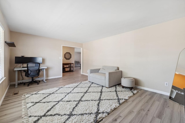 2051 E Fremont, Fresno, CA 93710 - home office featuring wood finished floors, plenty of natural light, and baseboards