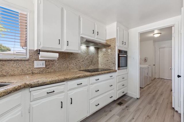 2051 E Fremont, Fresno, CA 93710 - kitchen featuring washer and dryer, oven, under cabinet range hood, black electric stovetop, and decorative backsplash