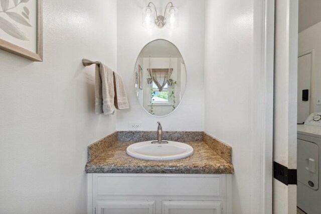 2051 E Fremont, Fresno, CA 93710 - bathroom with washer / clothes dryer and vanity