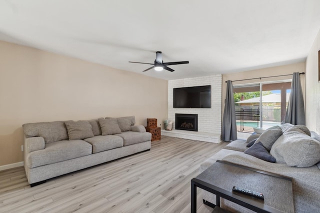 2051 E Fremont, Fresno, CA 93710 - living area with ceiling fan, wood finished floors, a fireplace, and baseboards
