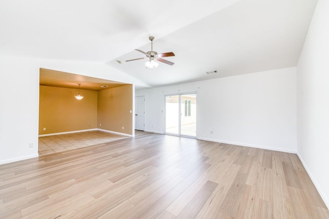 5164 W Michigan Ave, Fresno, CA 93722 - empty room featuring light wood-style flooring, vaulted ceiling, a ceiling fan, and baseboards