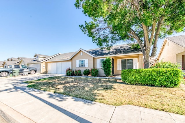 5164 W Michigan Ave, Fresno, CA 93722 - ranch-style house featuring concrete driveway, an attached garage, and a front yard