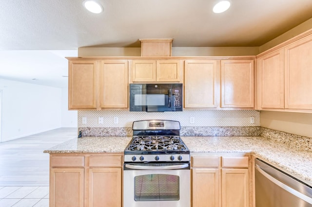 5164 W Michigan Ave, Fresno, CA 93722 - kitchen featuring light brown cabinetry, stainless steel appliances, light stone counters, baseboards, and recessed lighting