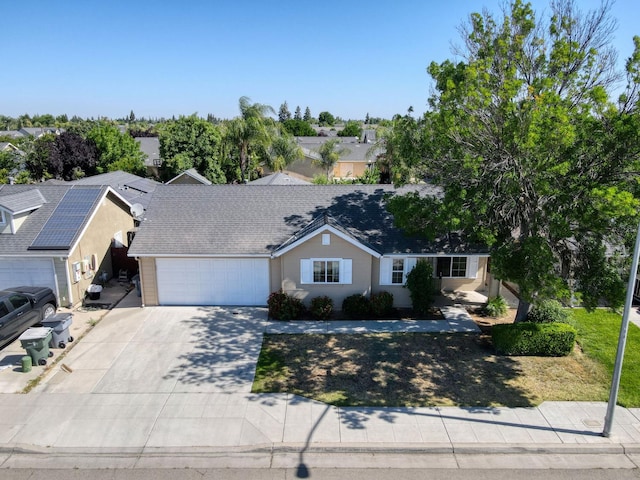 5164 W Michigan Ave, Fresno, CA 93722 - ranch-style house featuring a garage and driveway