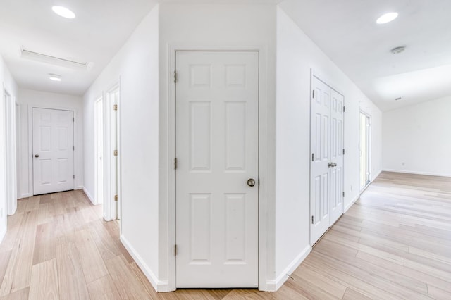 5164 W Michigan Ave, Fresno, CA 93722 - hallway featuring light wood-style floors, baseboards, and recessed lighting