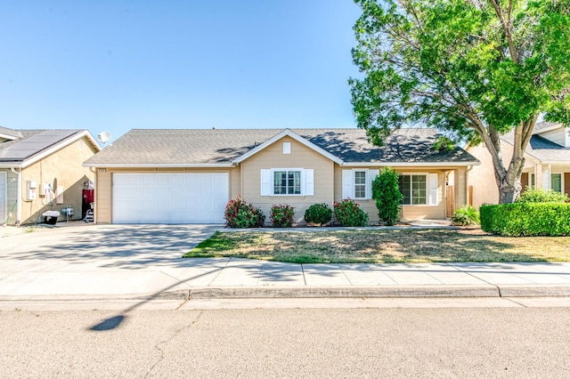 5164 W Michigan Ave, Fresno, CA 93722 - view of front of house with a garage and concrete driveway
