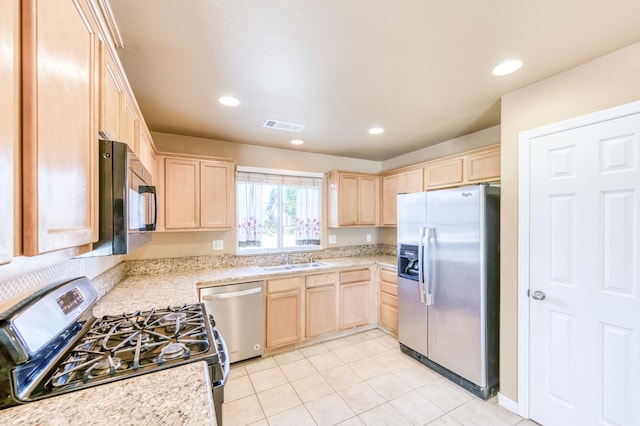 5164 W Michigan Ave, Fresno, CA 93722 - kitchen featuring appliances with stainless steel finishes, light brown cabinets, a sink, light tile patterned floors, and recessed lighting