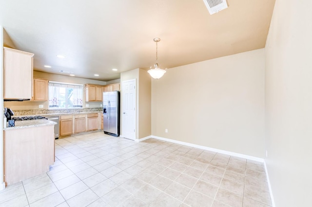 5164 W Michigan Ave, Fresno, CA 93722 - kitchen featuring appliances with stainless steel finishes, light brown cabinetry, light tile patterned floors, baseboards, and recessed lighting