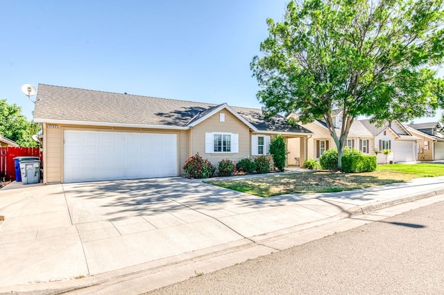 5164 W Michigan Ave, Fresno, CA 93722 - view of front facade with an attached garage and driveway