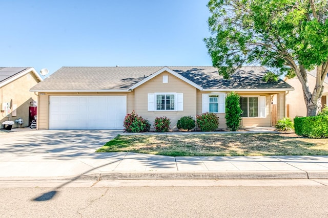 5164 W Michigan Ave, Fresno, CA 93722 - view of front facade with an attached garage and concrete driveway