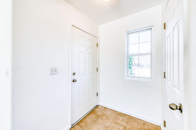 5164 W Michigan Ave, Fresno, CA 93722 - entryway with light tile patterned flooring and baseboards