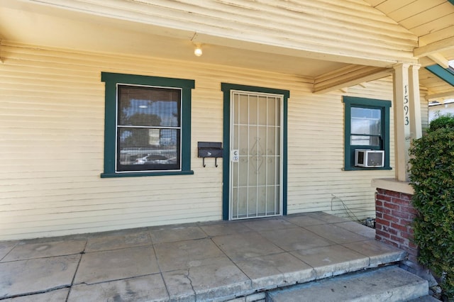 1593 N Glenn Ave, Fresno, CA 93728 - doorway to property with cooling unit and a porch