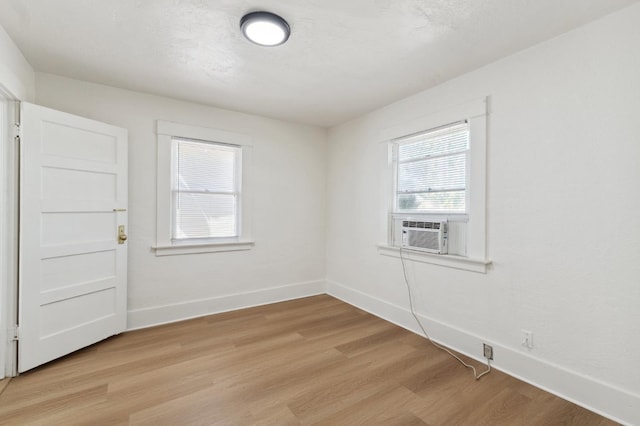 1593 N Glenn Ave, Fresno, CA 93728 - spare room featuring cooling unit and light wood-style floors