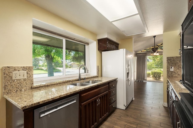 2081 Santa Ana Ave, Clovis, CA 93611 - kitchen with stainless steel dishwasher, a sink, white refrigerator with ice dispenser, dark brown cabinets, and dark wood-style floors