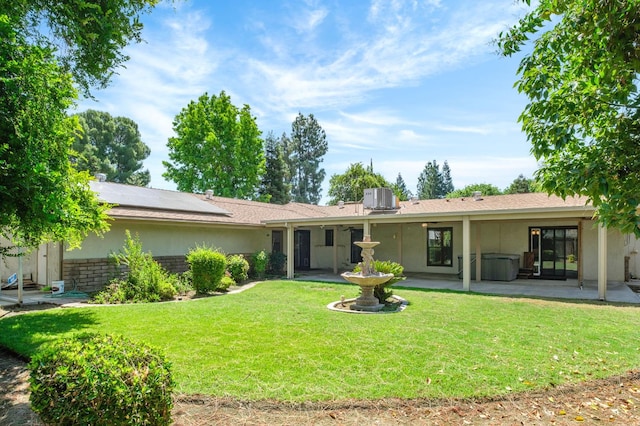 2081 Santa Ana Ave, Clovis, CA 93611 - back of property featuring a patio, a yard, central AC, and stucco siding