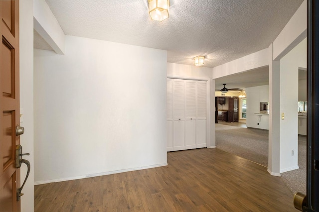 2081 Santa Ana Ave, Clovis, CA 93611 - empty room featuring a textured ceiling, wood finished floors, baseboards, and ceiling fan