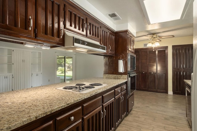 2081 Santa Ana Ave, Clovis, CA 93611 - kitchen with appliances with stainless steel finishes, light wood-style flooring, ceiling fan, dark brown cabinets, and light stone countertops
