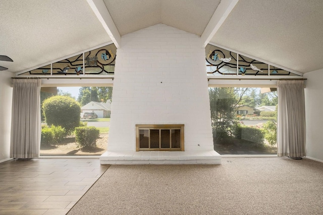 2081 Santa Ana Ave, Clovis, CA 93611 - unfurnished living room with vaulted ceiling, a textured ceiling, a brick fireplace, and baseboards