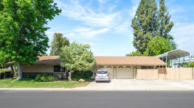 2081 Santa Ana Ave, Clovis, CA 93611 - view of front of home featuring driveway, a garage, and stucco siding