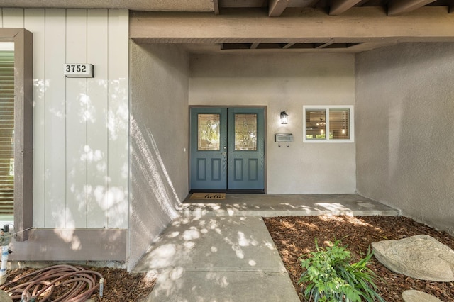 3752 N Augusta St, Fresno, CA 93726 - view of exterior entry featuring french doors and board and batten siding