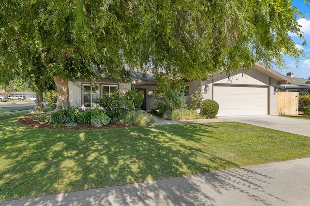 3752 N Augusta St, Fresno, CA 93726 - view of front facade featuring concrete driveway, a garage, and a front yard