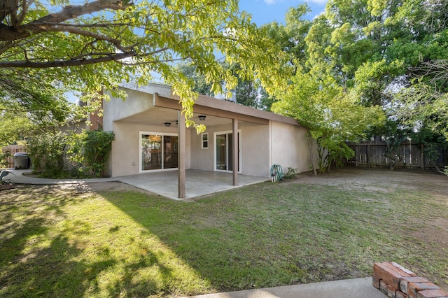 3752 N Augusta St, Fresno, CA 93726 - rear view of property with stucco siding and a patio area