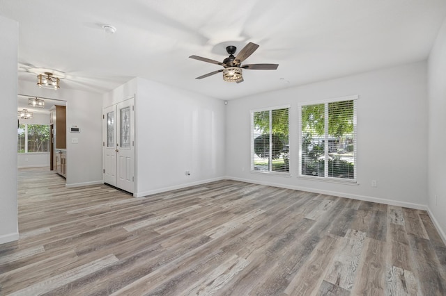 3752 N Augusta St, Fresno, CA 93726 - unfurnished room with baseboards, ceiling fan, and wood finished floors
