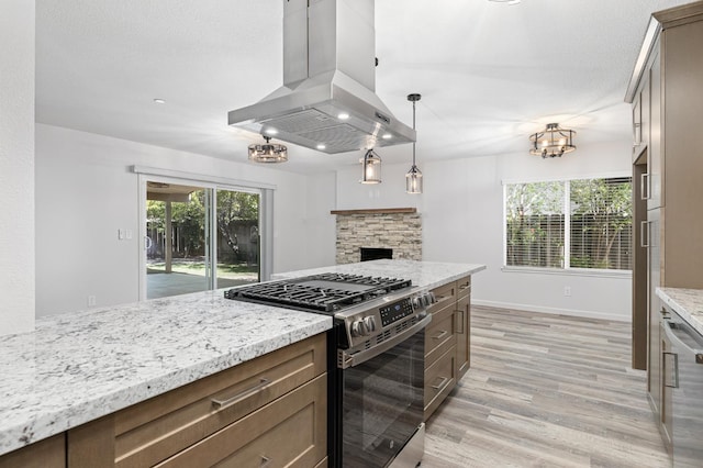 3752 N Augusta St, Fresno, CA 93726 - kitchen with stainless steel appliances, island exhaust hood, light wood-style flooring, and light stone counters